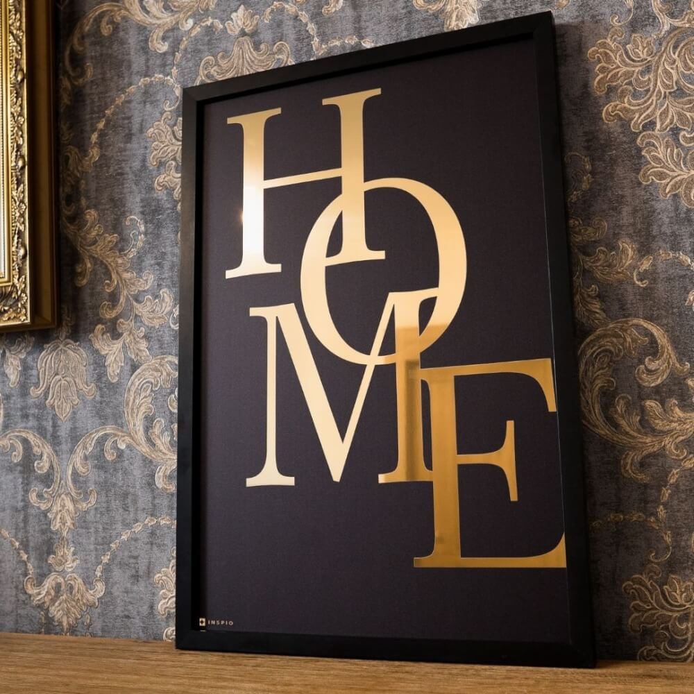 Wandbild, goldener Text und schwarzer Holzrahmen - Über Zuhause
